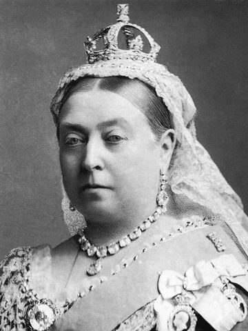 Queen Victoria as an old woman, with a small crown and a white veil, in a black-and-white photo