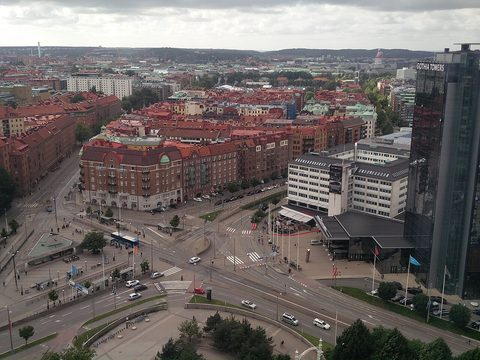 The city of Gothenburg seen from above: big buildings, busy streets and a tall glass tower