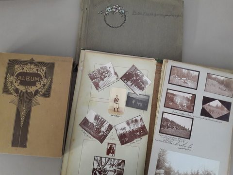 An open photo album with old black and white photos